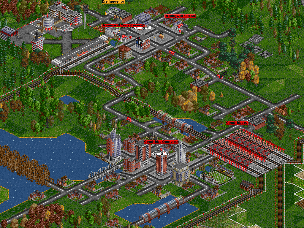 A bus riding through a town in Transport Tycoon
